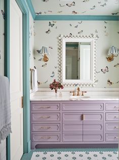 the bathroom is decorated in pastel colors