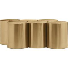 four rolls of gold colored toilet paper on a white background