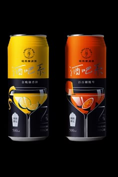 two cans of drinks with oranges and lemon slices