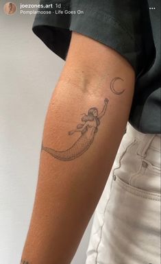 a person with a tattoo on their arm