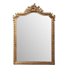 an ornate gold framed mirror against a white background