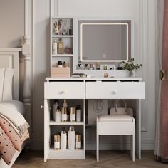 a white vanity with drawers and a mirror on it in a bedroom next to a bed