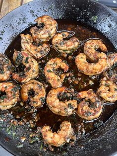 cooked shrimp and greens in a skillet ready to be eaten