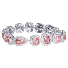 This exquisite ladies bracelet features a stunning array of natural diamonds, perfectly complemented by sparkling round white diamonds. The diamonds are of F-G color and VS+ clarity, ensuring exceptional brilliance and quality. The bracelet is meticulously crafted in 18k white gold to highlight the beauty and unique allure of each stone. Details: Center Stone: 16.58ct (15 pieces) of fancy diamonds Round White Diamonds: 3.84ct (696 pieces), F-G color, VS+ clarity Total Weight: 30.50g Metal: 18k w Luxury Pink Diamond Bracelets, Colored Diamond Jewelry, 18k Gold Bracelet, Bracelet Tennis, Ladies Bracelet, Pink Diamonds, Gold Bracelet For Women, Fancy Diamonds, Rare Gems