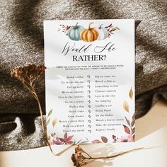 a white paper with a fall themed wedding checklist on it and some dried flowers