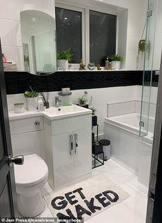 a bathroom with a toilet, sink and bathtub