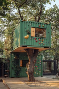 a tree house made out of shipping containers