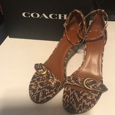 New In Box Never Worn Coach Sandals In Tan And Black Animal Print Size 9 In 3 Inch Wedge Heels. Super Cute Casual Coach High Heels, Chic Coach Sandals With Wedge Heel, Coach Casual High Heel Wedge Sandals, Coach Casual Wedge Heel Sandals, Casual Brown Coach Heels, Coach Brown High Heel Sandals, Chic Brown Coach Sandals, Chic Coach Wedge Sandals, Brown Coach High Heel Sandals