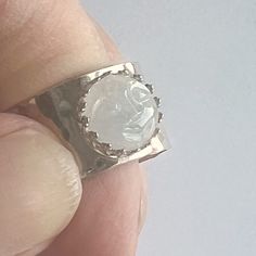 "Beautifully carved winking Moon Face in 10MM Gemstone Cabochon set in 1/2\" wide hammered, sterling silver band. Choose between Amethyst or Moonstone.  Due to the deep purple color of the Amythest, the carved face is extremely clear to see. The gorgeous white moonstone carved face, becomes more clear when the light hits the stone.  Both have a cute cartoon-like quality to them. Both bands are sized 9, but given the extremely wide band, I would say they fit more like an 8.5 to 8 3/4.  I have not set the stones, so when ordering please indicate whether you would like the cabochon set in the crown bezel or the plain one. Both bands are stamped 925. These are substantial rings: modern and clean. This listing is for 1 ring Thanks for stopping by." Face Carving, Deep Purple Color, Moon Face, White Moonstone, Hammered Sterling Silver, Wide Rings, Sterling Silver Bands, Wide Bands, Moon Stone