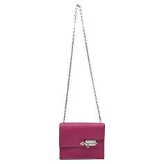 Rose Pourpre Hermes Mini Verrou Crossbody Bag. The Mini Verrou Crossbody Bag features a leather body, silver-tone hardware, a single chain-link shoulder strap, metal feet at bottom, and a front flap clasp closure. 6.75" L x 5.5" H x 2" D, 15.75" shoulder strap drop. Luxury Wardrobe, Fashion Handbags, Purses Crossbody, Chain Link, Metallica, Crossbody Bag, Silver Tone, Shoulder Strap, Handbags