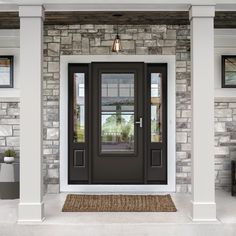 a front door with two sidelights and a rug on the floor in front of it