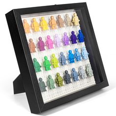 lego minifigure display in black frame with multicolored figures on white background