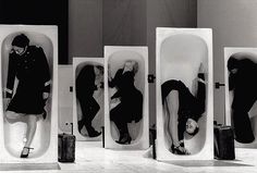 three men and two women in urinals on the floor