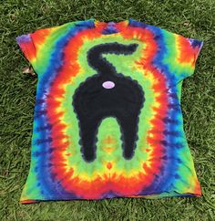 a tie - dyed t - shirt with a black cat on it's back