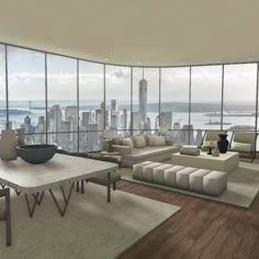 a living room filled with furniture and large windows overlooking a cityscape in the distance