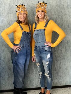 two women in overalls are standing next to each other