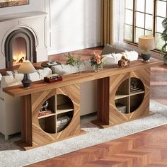 a living room filled with furniture and a fire place in the middle of the room