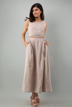 "DETAILS:- Includes Top and Skirt - Backless Top with Tie Belt Length 16\" | 41 cm - Sleeveless Crop Top - Soft linen Maxi Skirt length 36\" | 91 cm - Elasticated Back Waist Skirt with Side Pockets - Detailed with folds in front to provide more flare and decent look - 100% Lightweight Linen - Customization Available Check the link below for my shop ---------------------------------------- https://www.etsy.com/in-en/shop/Magicsilvercraft https://www.etsy.com/in-en/shop/PehroDesign --------------- Cottagecore Wedding Dress, Linen Tunics For Women, Linen Dress Summer, Linen Tunic Dress, Long Linen Dress, Backless Top, Summer Linen Dresses, Linen Shirt Dress, Loose Fitting Dresses