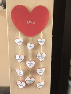 a valentine's day card with hearts attached to it