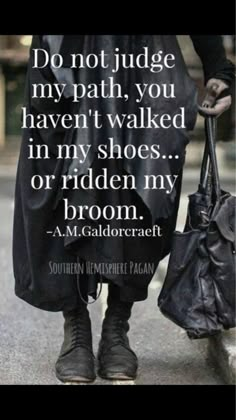 a man walking down the street with a handbag in his pocket and a quote on it