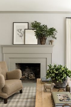 the living room is clean and ready for us to use it's fireplace as a focal point