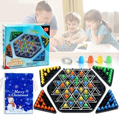 the christmas game is set up to play with two children and an adult in front of it