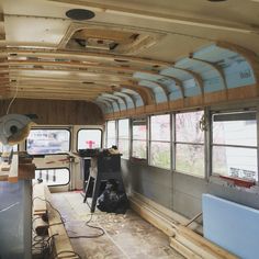 the interior of an old bus is being remodeled with wood planks and new paint