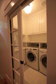 a washer and dryer in a small room