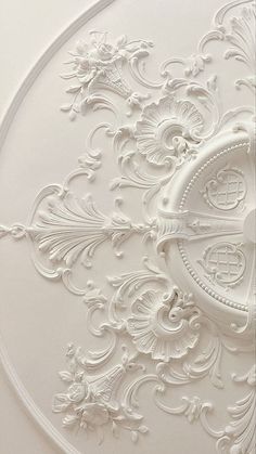 an intricately designed ceiling with white paint