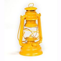 an old fashioned yellow lantern on a white background