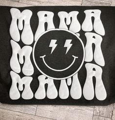 a black and white t - shirt with lightning bolt on it