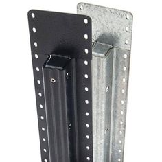 two metal brackets are attached to the side of a wall mounted device with screws