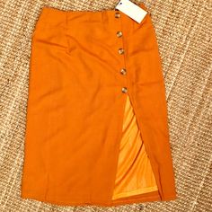 Slit At Front High Waisted Skirt With Faux Button Down Closure. Measurements Waist: 15.5” Length: 28” Slit Length: 15” High Waisted Midi Skirt, Skirts Midi High Waisted, Women Skirts Midi, Color Orange, High Waisted Skirt, Midi Skirt, Womens Skirt, High Waisted, Skirt