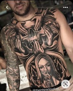 a man with tattoos on his chest and hands holding a skull in front of him