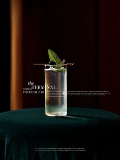 a glass filled with water sitting on top of a table