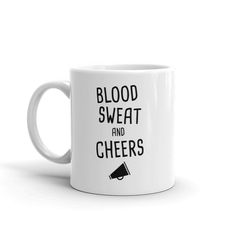 a white coffee mug with the words blood sweat and cheers written on it in black