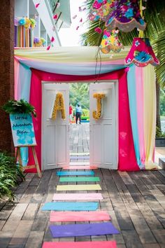 an entrance to a party with colorful decorations