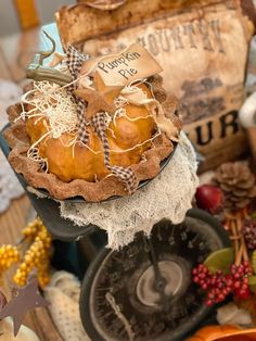 a table topped with pumpkins and other decorations