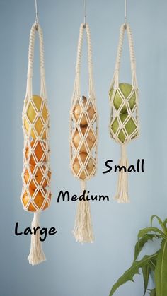 three macrame hangings with small balls in them and the words small medium large