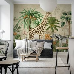 a living room with a zebra and giraffe mural on the wall, next to two stools