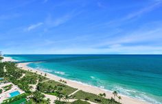 an aerial view of the beach and ocean