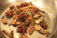 an assortment of spices in a metal bowl