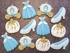 decorated cookies in the shape of princess dresses and shoes