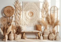 an assortment of vases and other decorative items on a white surface with sunlight coming through the window