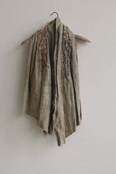 an old jacket hanging on a wall