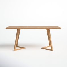 a wooden table sitting on top of a white floor