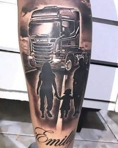 a man with a tattoo on his leg that has an image of two people and a truck