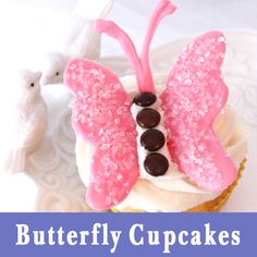 a cupcake decorated with pink and white icing