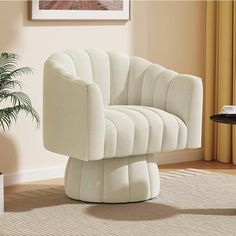 a white chair sitting on top of a rug in a living room