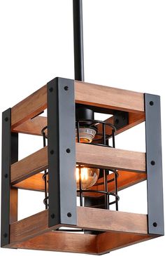 a wooden light fixture hanging from a metal frame ceiling lamp with two lights on each side